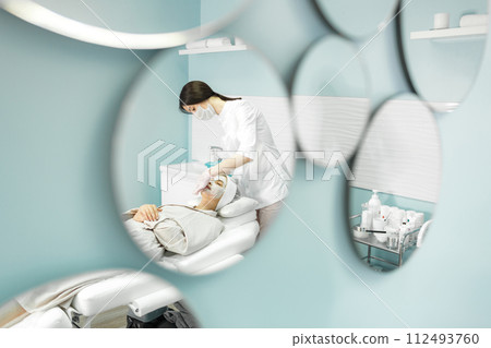Young and beautiful girl in the clinic of natural beauty Young and beautiful girl in the clinic of natural beauty 112493760