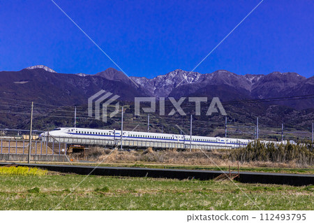 [Shizuoka Prefecture_Fuji City_Shinkansen] Mt. Fuji and Tokaido Shinkansen in the blue sky 112493795