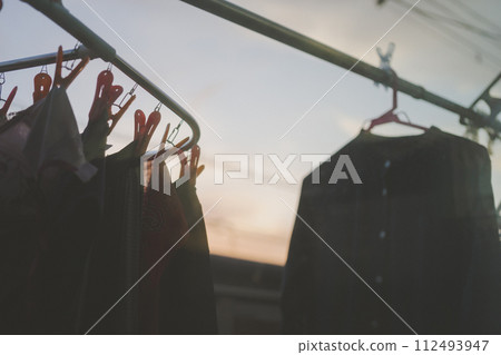 Laundry left to dry outside until evening 112493947
