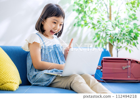 Elementary school student computer home 112494218