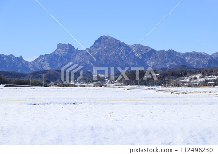 Snow-covered rice fields and Mt. Myogi Snow-covered rice fields and Mt. Myogi 112496230