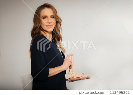 Doctor explaining operation to foot on bone model Doctor explaining operation to foot on bone model 112496261