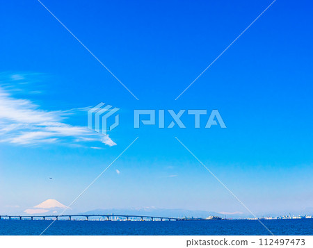 Aqualine, blue sky, sea and Mt. Fuji seen from Sodegaura coast Aqualine, blue sky, sea and Mt. Fuji seen from Sodegaura coast 112497473