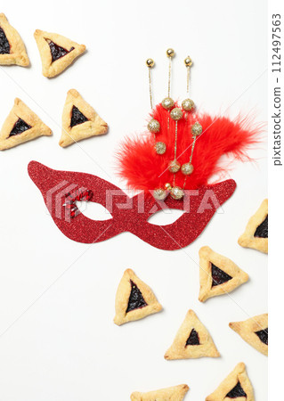 A mask with traditional cookies for the day of Purim. A mask with traditional cookies for the day of Purim. 112497563