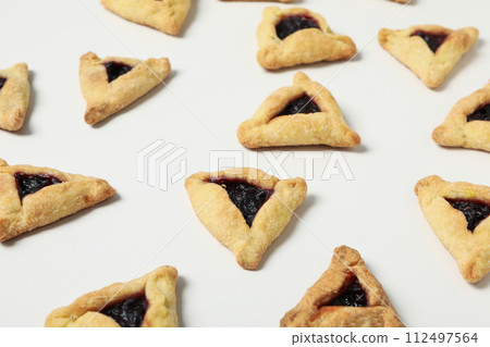 A mask with traditional cookies for the day of Purim. A mask with traditional cookies for the day of Purim. 112497564