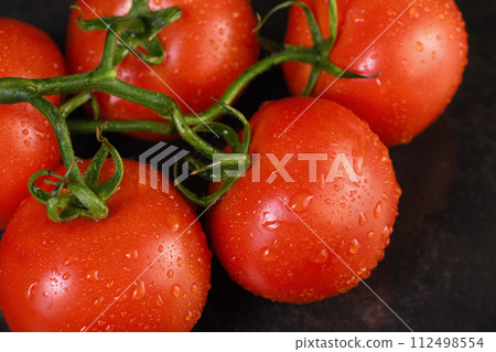 Fresh ripe red tomatoes branch Fresh ripe red tomatoes branch 112498554