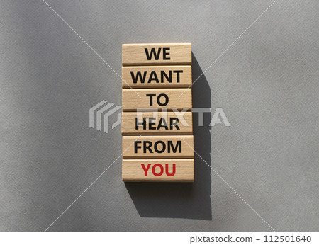 We want to hear from you symbol. Wooden blocks with words We want to hear from you. Beautiful grey background. Business and We want to hear from you. Copy space. 112501640