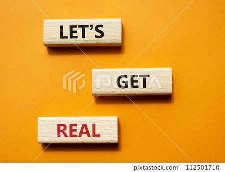 Lets get real symbol. Concept words Lets get real on wooden blocks. Beautiful orange background. Business and Lets get real concept. Copy space. 112501710