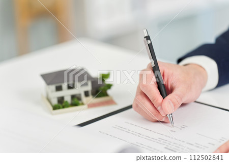 Businessman signing a real estate contract 112502841