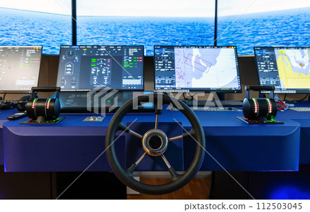 Modern ship control panel with steering wheel and engine accelerators Modern ship control panel with steering wheel and engine accelerators 112503045