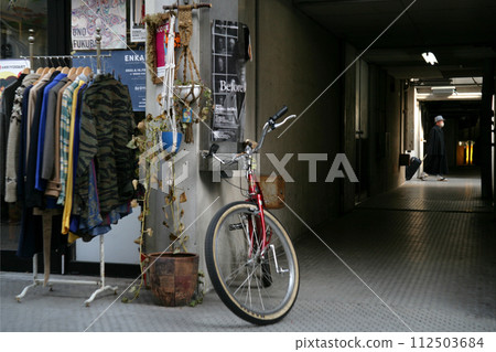 Bicycle in front of second-hand clothing store Bicycle in front of second-hand clothing store 112503684