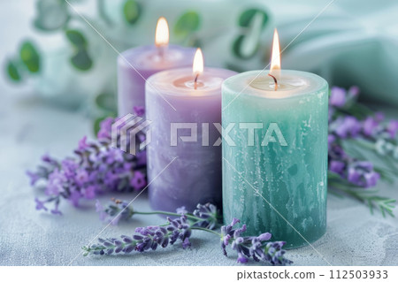 Violet and mint green candles with lavender flowers on background. Generative AI 112503933