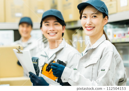 Young staff working on boxes 112504153