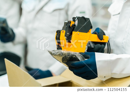 Young staff working with boxes, faceless Young staff working with boxes, faceless 112504155
