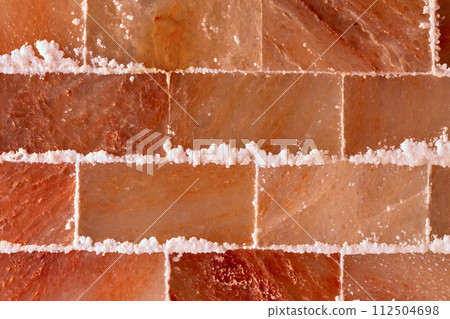 Himalayan pink salt wall in spa or sauna room 112504698