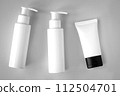White bottles and tube of cosmetic products background 112504701