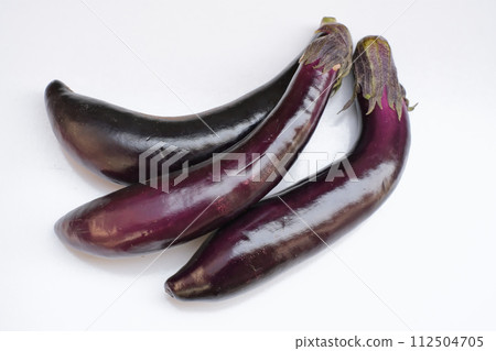 Aubergine as a summer vegetable photographed on a white background 112504705