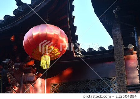 red Chinese lantern made of paper decorating in front of home at China red Chinese lantern made of paper decorating in front of home at China 112504894