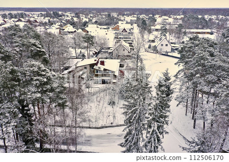 Aerial View of a Small Village in the Flat Northern Germany After the First Snow 112506170