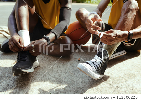 Black men wearing sports shoes for playing streetball Black men wearing sports shoes for playing streetball 112506223