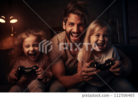 Happy father and his two daughters laugh as they enjoy playing console games in a cozy room 112506465