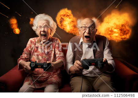 Elderly couple exhilarated playing with video game controllers with explosive background 112506498