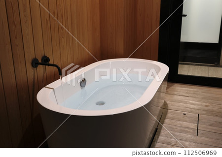 Filling the bathtub with hot water Filling the bathtub with hot water 112506969