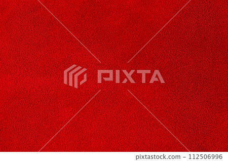 Red suede as a background. Macro photo of velvety red texture. 112506996