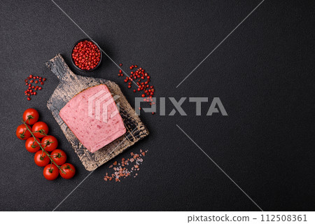 Delicious canned pink ham with salt, spices and herbs 112508361