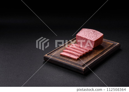 Delicious canned pink ham with salt, spices and herbs Delicious canned pink ham with salt, spices and herbs 112508364
