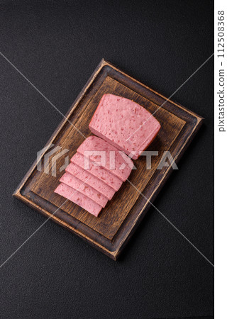 Delicious canned pink ham with salt, spices and herbs 112508368