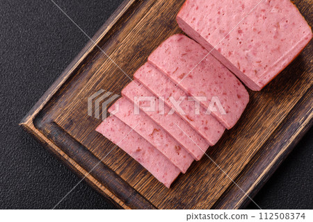 Delicious canned pink ham with salt, spices and herbs 112508374