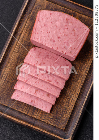 Delicious canned pink ham with salt, spices and herbs 112508375