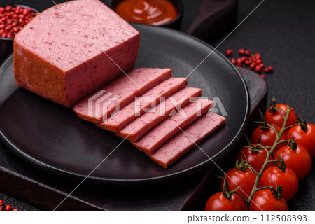 Delicious canned pink ham with salt, spices and herbs 112508393