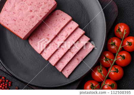 Delicious canned pink ham with salt, spices and herbs 112508395