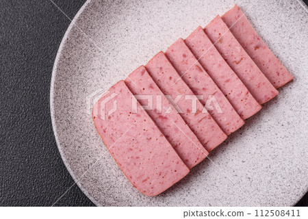 Delicious canned pink ham with salt, spices and herbs Delicious canned pink ham with salt, spices and herbs 112508411