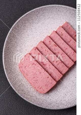 Delicious canned pink ham with salt, spices and herbs 112508412