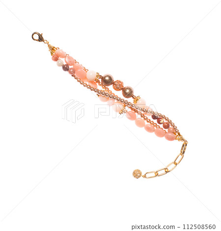 Pink and gold bracelet with pearl, carnelian, agate, opal isolated on white background Pink and gold bracelet with pearl, carnelian, agate, opal isolated on white background 112508560