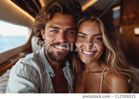 Young couple in an aircraft flying for holidays Young couple in an aircraft flying for holidays 112508815