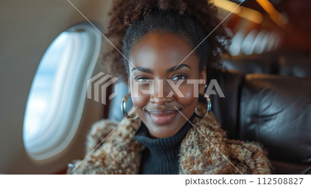 Beautiful business lady seating in a privat jet 112508827