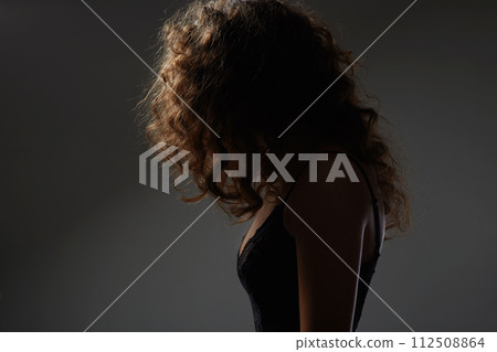 curly Hair Girl silhouette. Beautiful young Woman 112508864