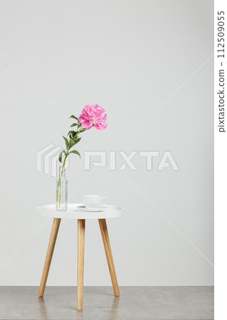 beautiful peonies in a vase on a white background beautiful peonies in a vase on a white background 112509055