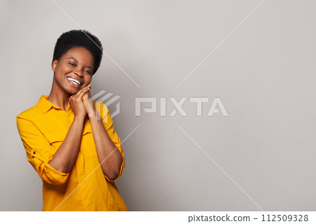 Lovely successful woman smiling and having fun against studio wall banner background 112509328