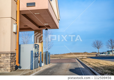 Banking automated teller machine lane in a small town 112509456