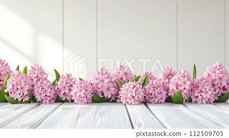 Spring summer soft background with flowers and wooden table for product presentation 112509705