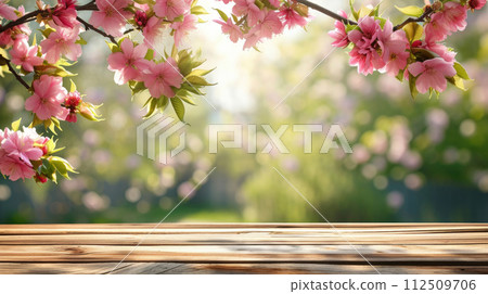 Spring summer soft background with flowers and wooden table for product presentation 112509706