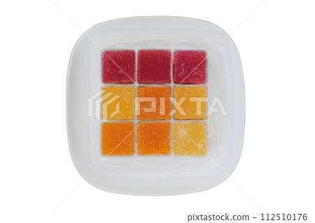 Marmalade in a plate isolated on white background. Sweet desserts in plate for the holiday. Top view. Marmalade in a plate isolated on white background. Sweet desserts in plate for the holiday. Top view. 112510176