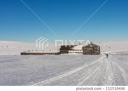 Meadow Hut , ski lodge,  krkonose mountains, Czech Republic. Winter sunny day. 112510498