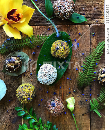 Handmade balls of flax grains on green plant leaves. AI-generated item Handmade balls of flax grains on green plant leaves. AI-generated item 112510825
