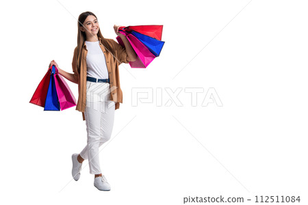 image of teen girl shopaholic with bags, copy space. teen girl shopaholic isolated on white. 112511084